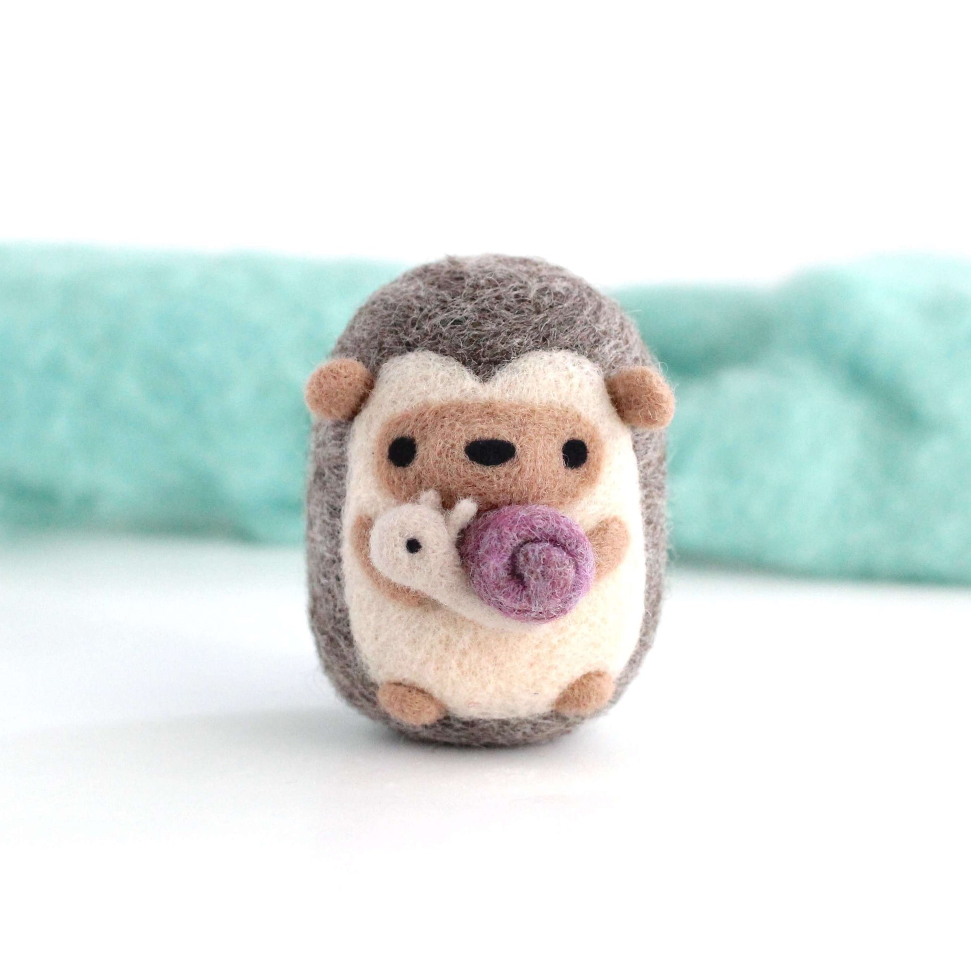 Needle Felted Hedgehog holding Snail by Wild Whimsy Woolies