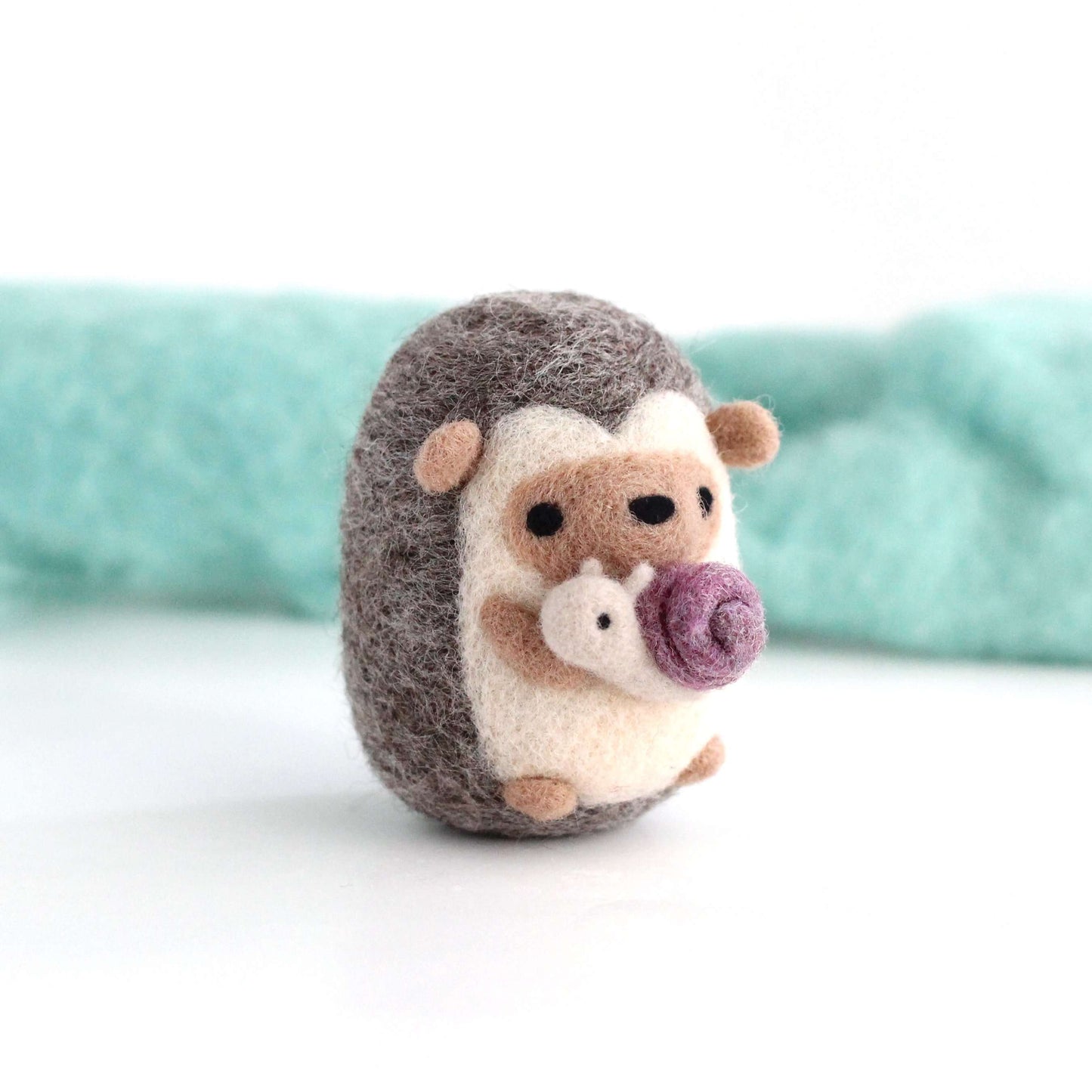 Needle Felted Hedgehog holding Snail