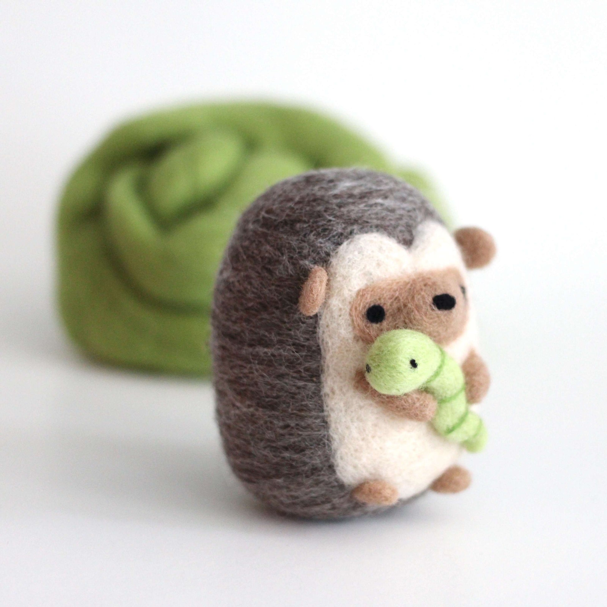 Needle Felted Hedgehog holding Worm by Wild Whimsy Woolies