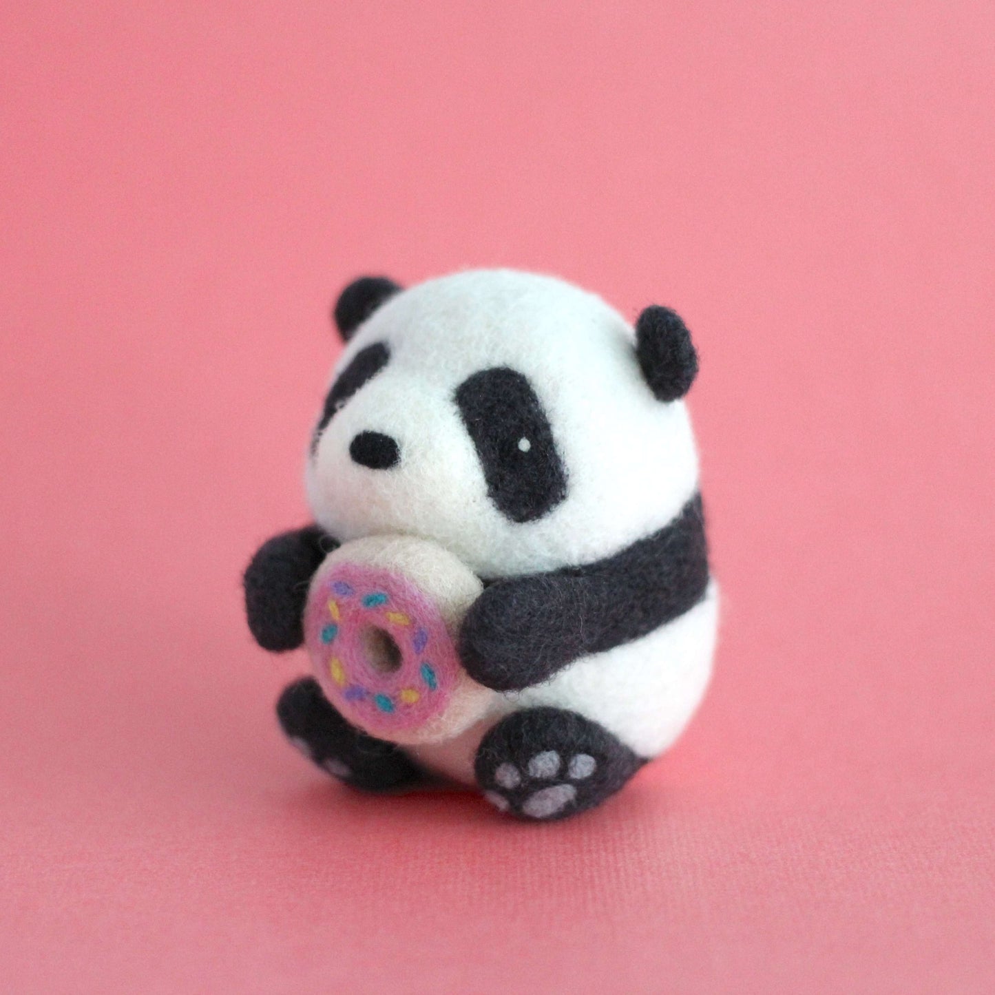 Needle Felted Panda holding Donut by Wild Whimsy Woolies