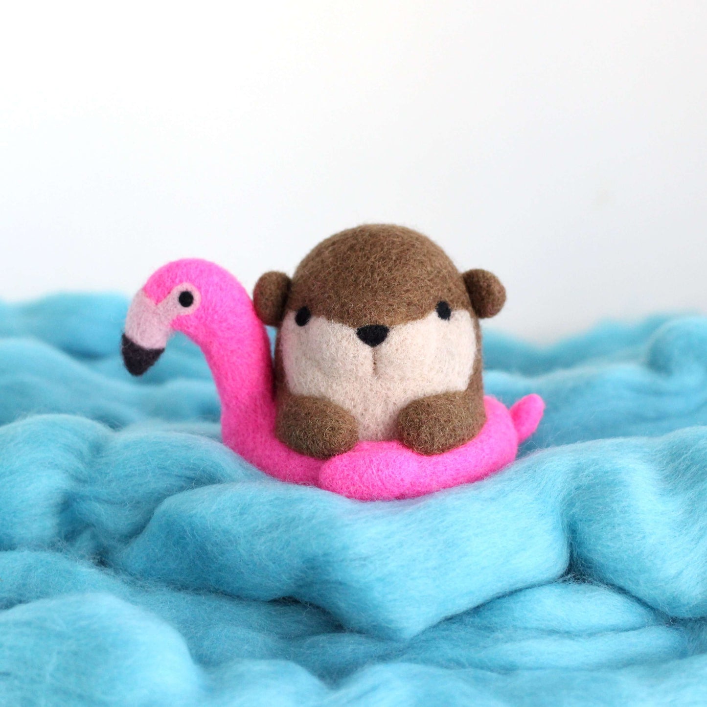 Needle Felted River Otter in a Flamingo Floatie