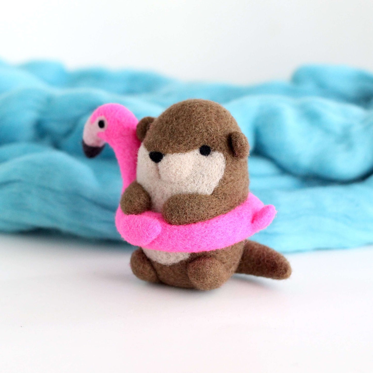 Needle Felted River Otter in a Flamingo Floatie