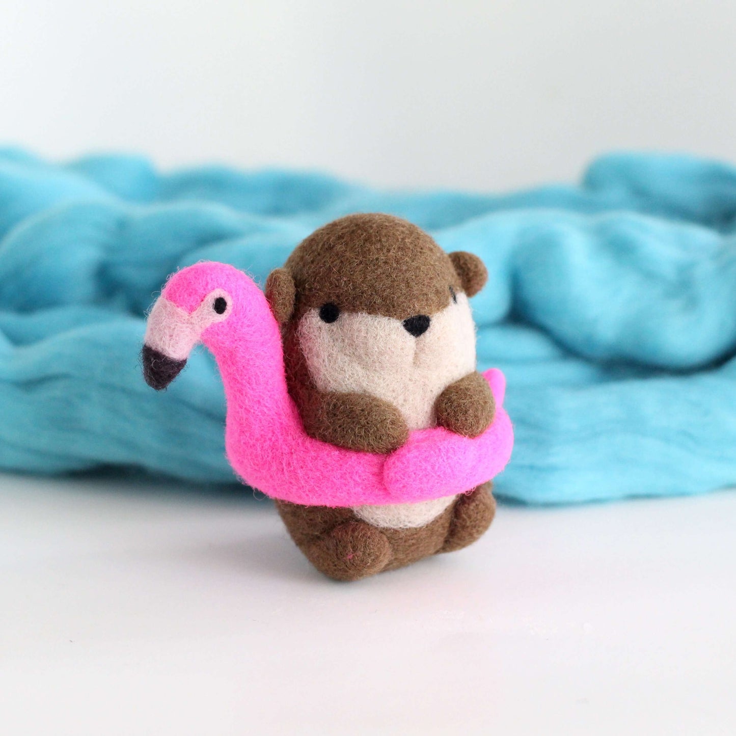 Needle Felted River Otter in a Flamingo Floatie