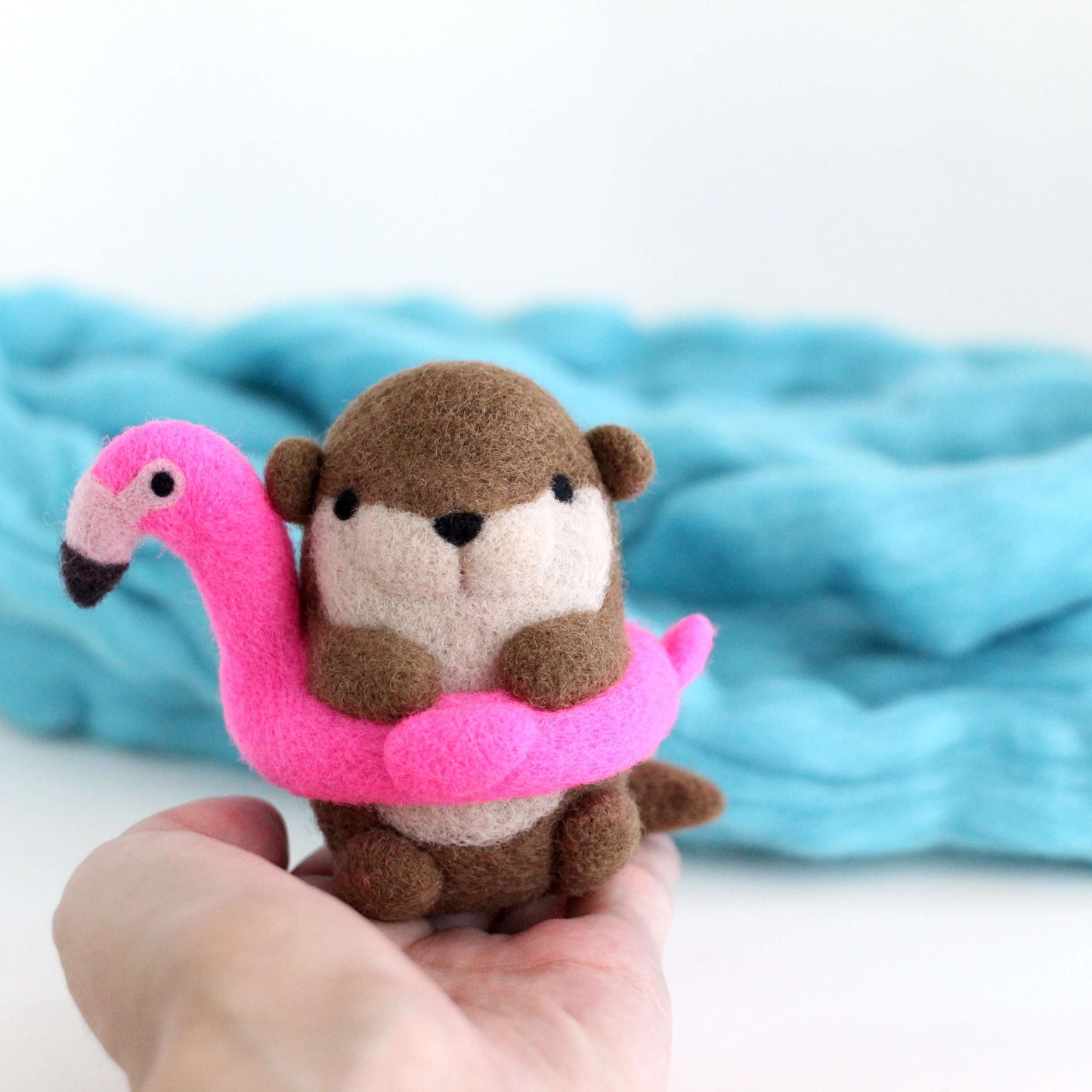 Needle Felted River Otter in a Flamingo Floatie