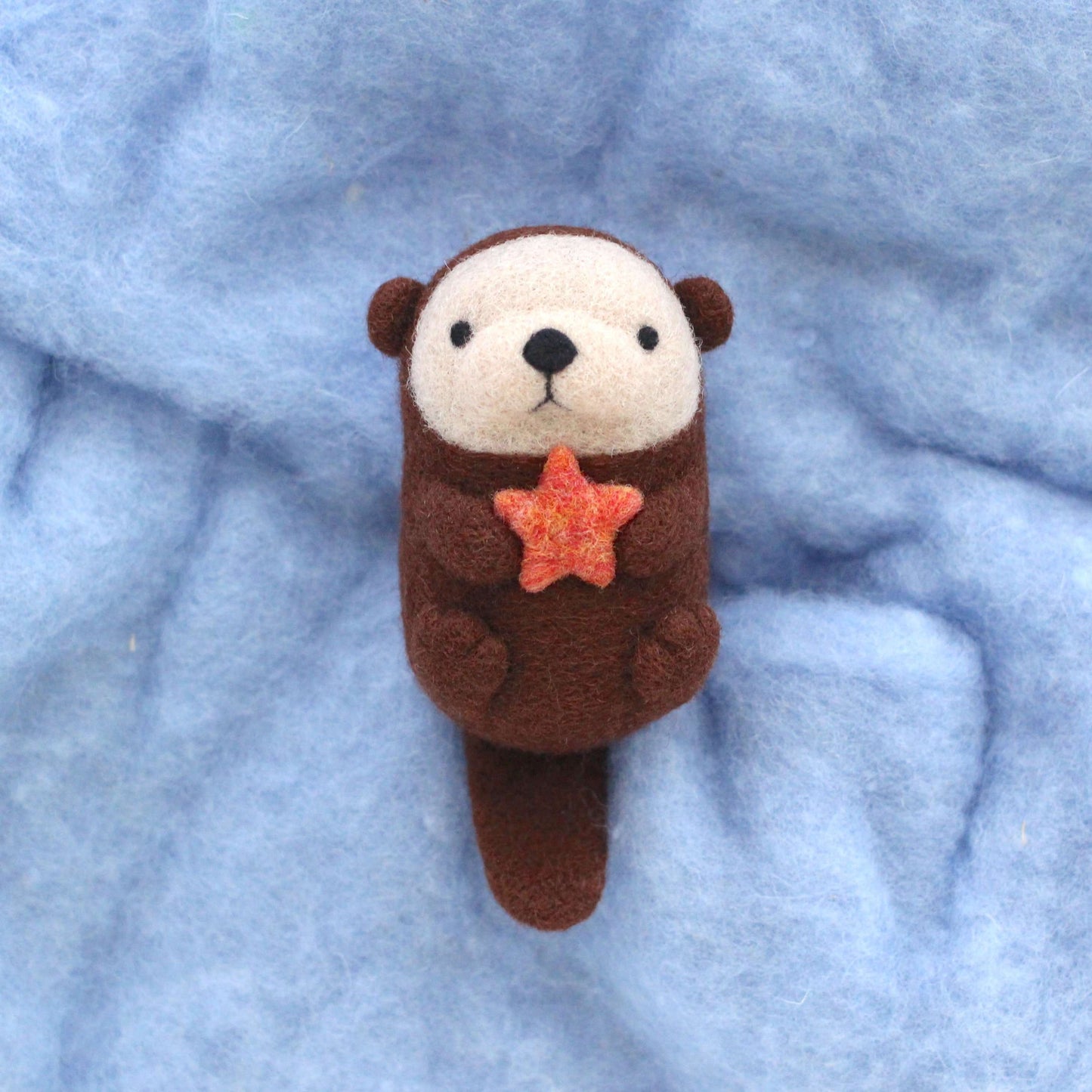 Needle Felted Sea Otter holding Starfish