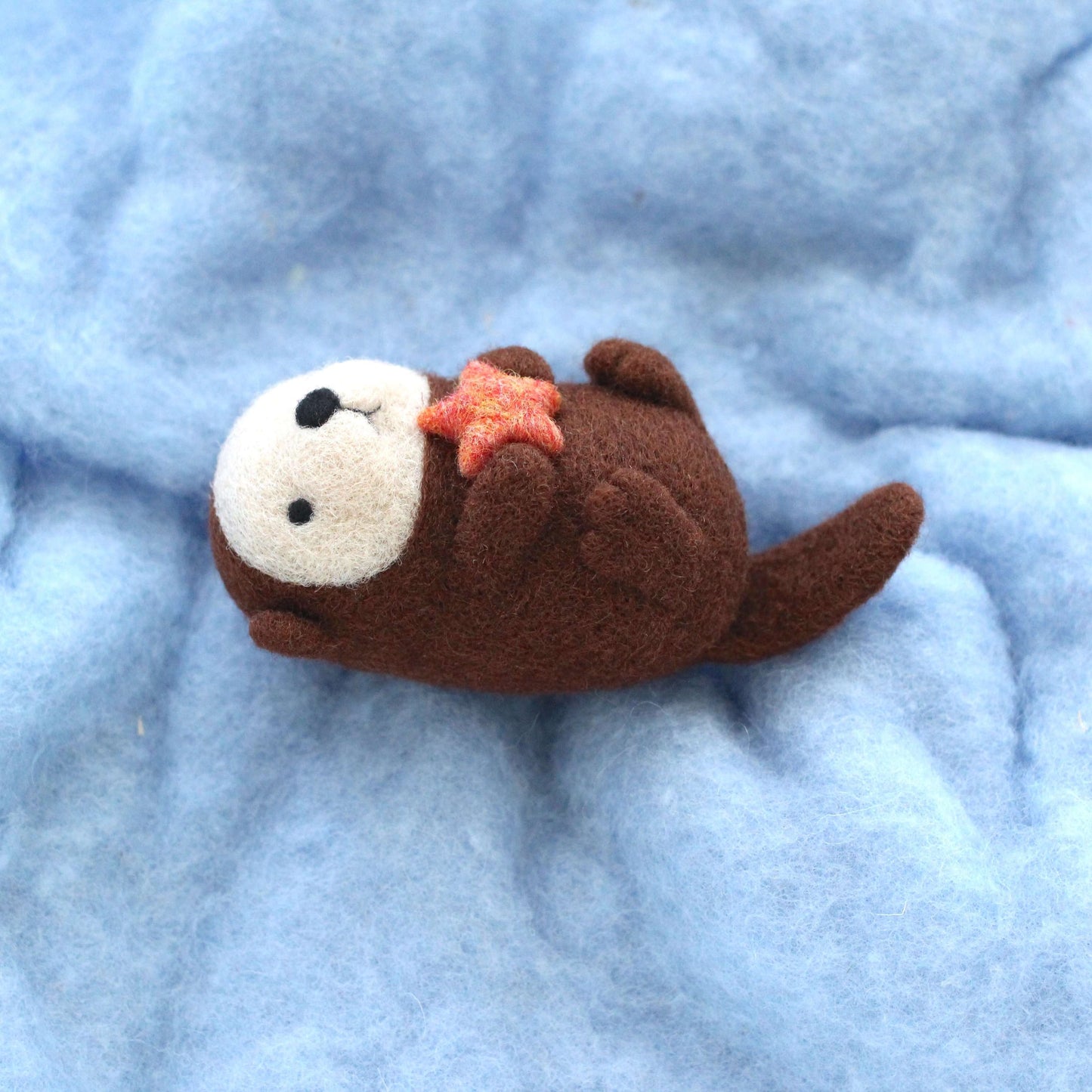 Needle Felted Sea Otter holding Starfish