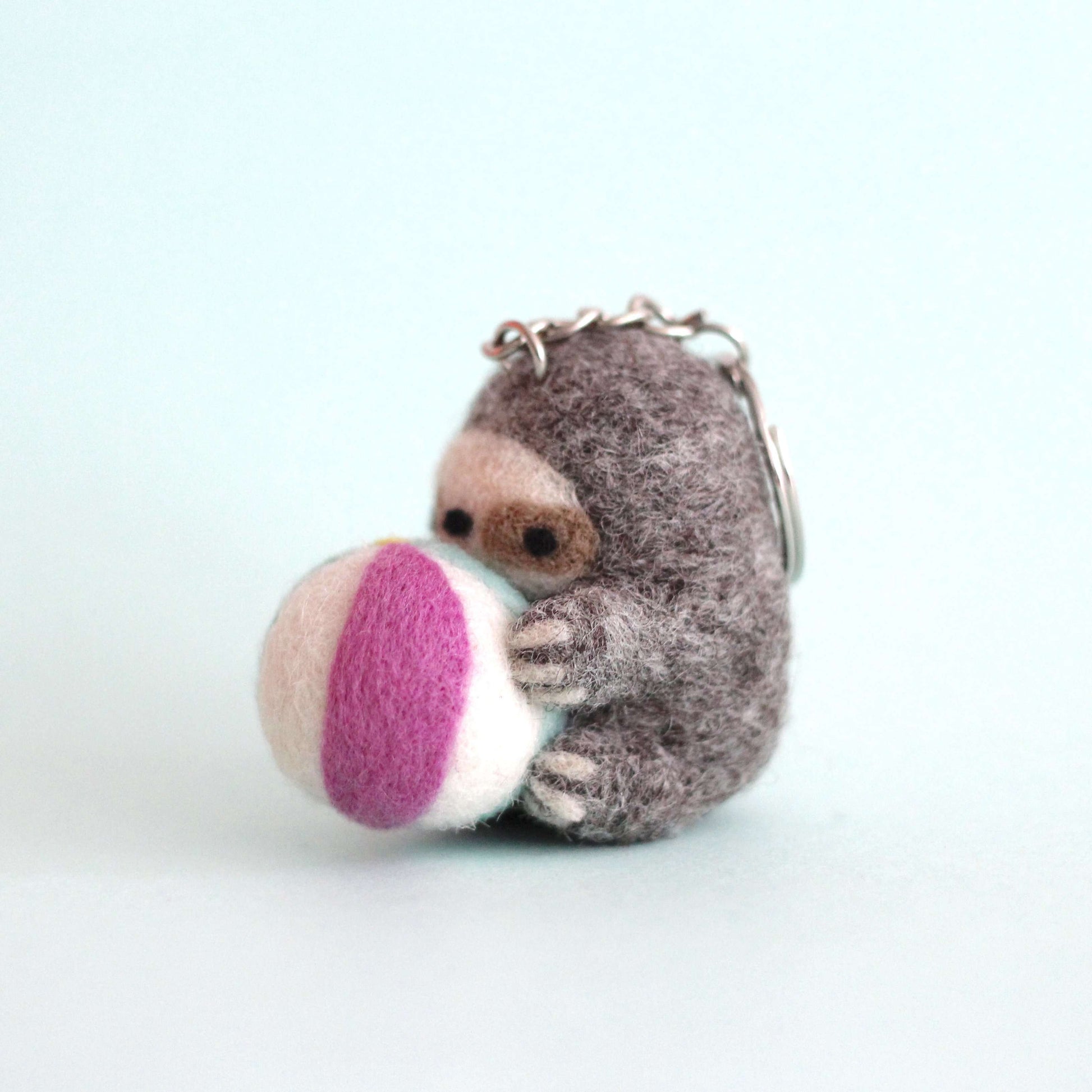 Needle Felted Sloth Holding a Beach Ball Keychain by Wild Whimsy Woolies