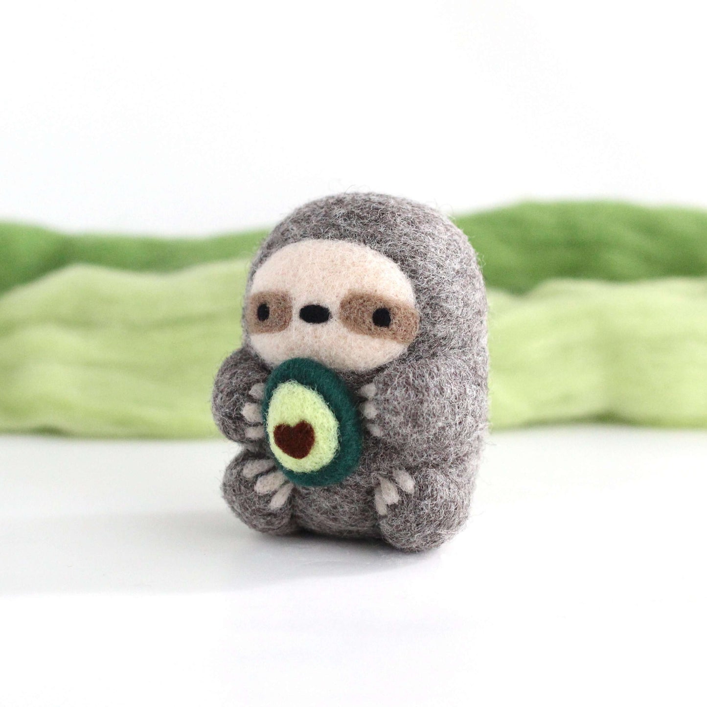 Needle Felted Sloth holding Avocado by Wild Whimsy Woolies