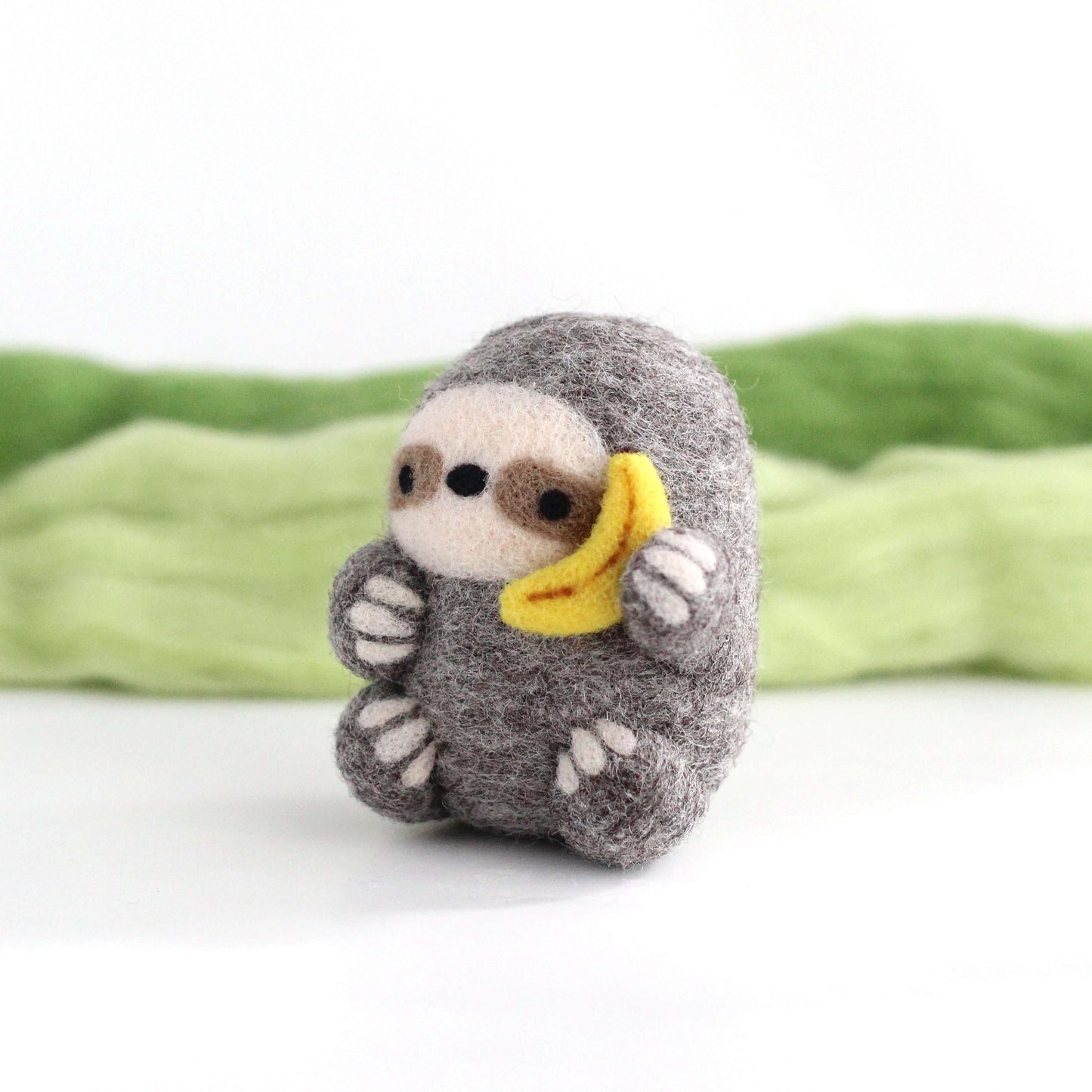 Needle Felted Sloth holding Banana Phone by Wild Whimsy Woolies