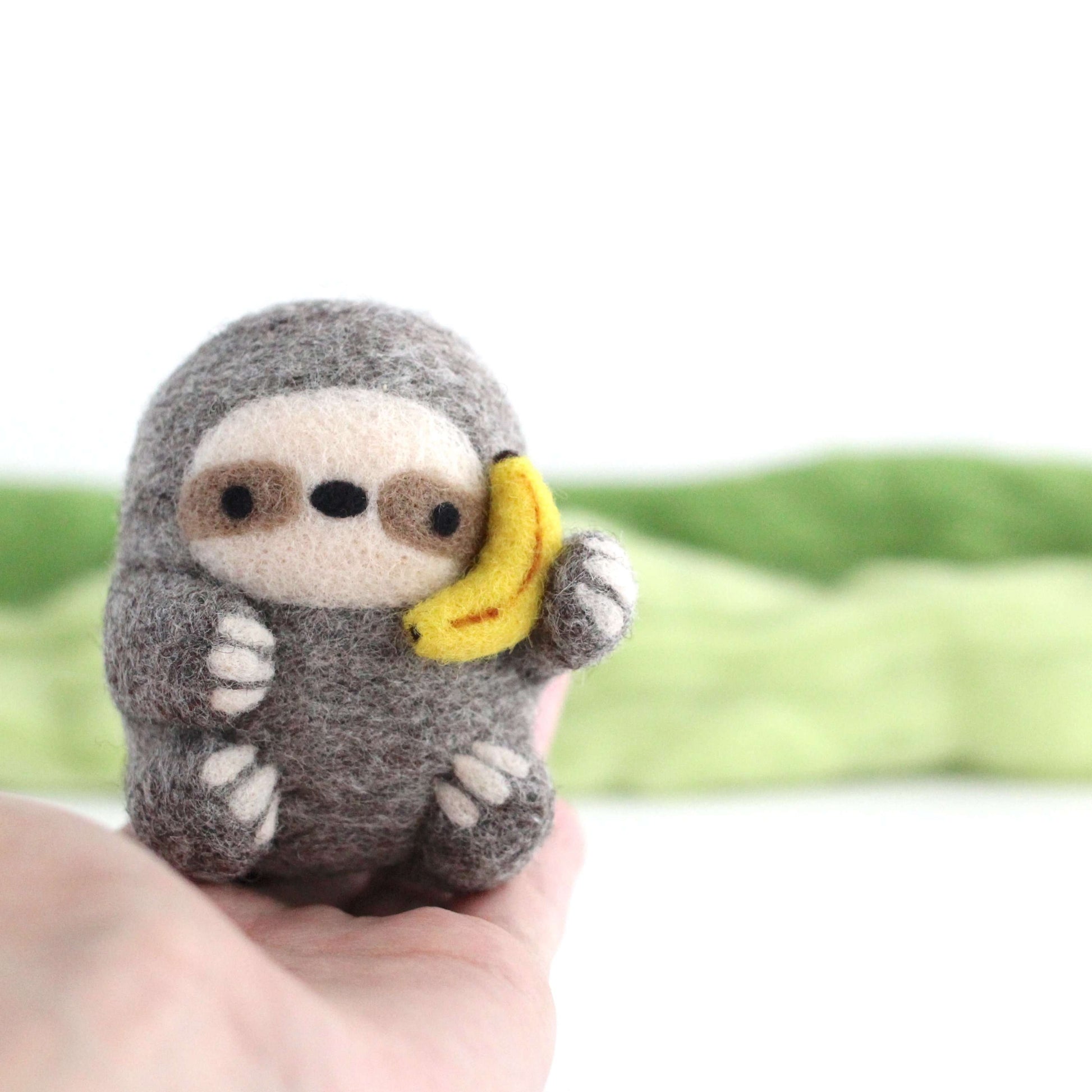 Needle Felted Sloth holding Banana Phone