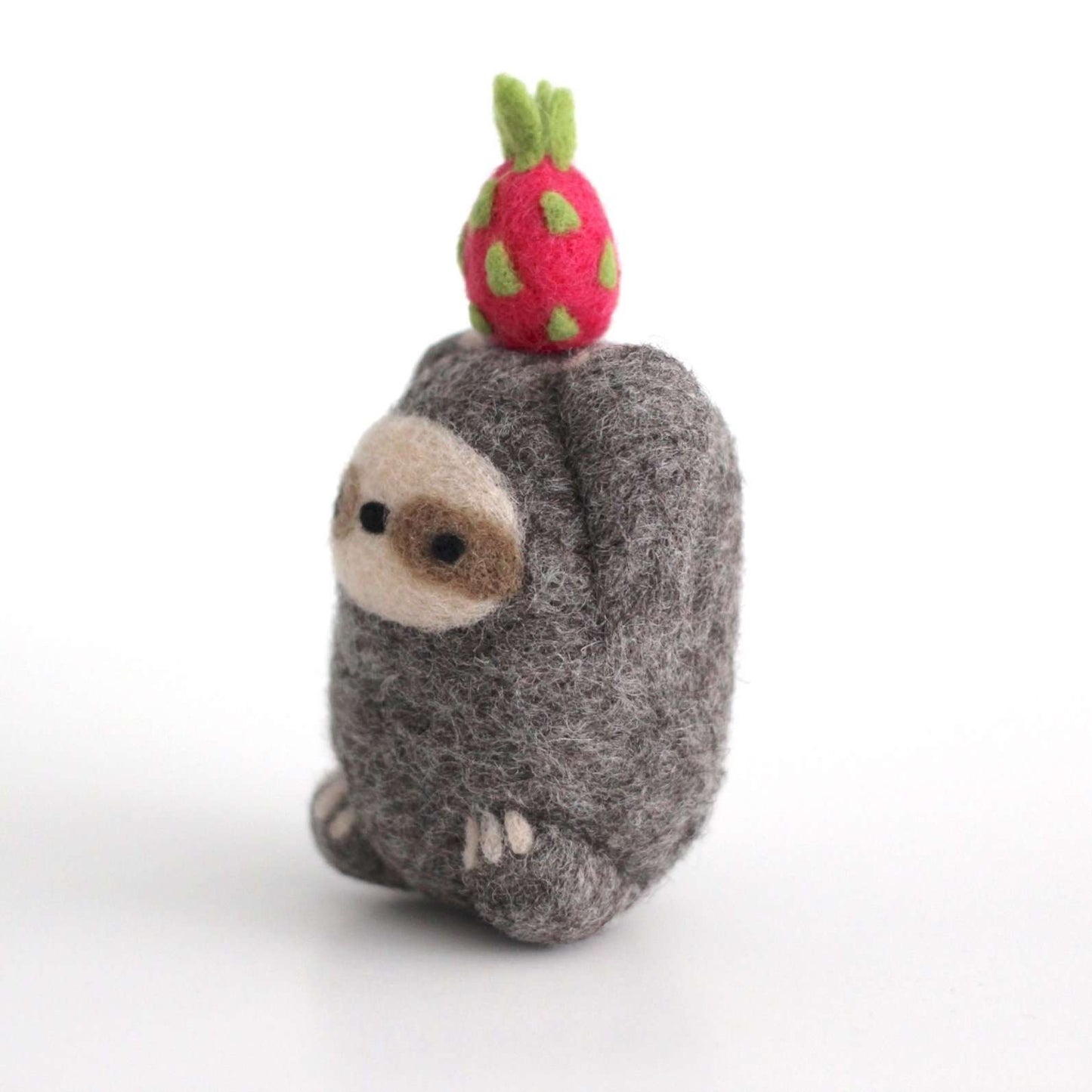 Needle Felted Sloth holding Dragon Fruit