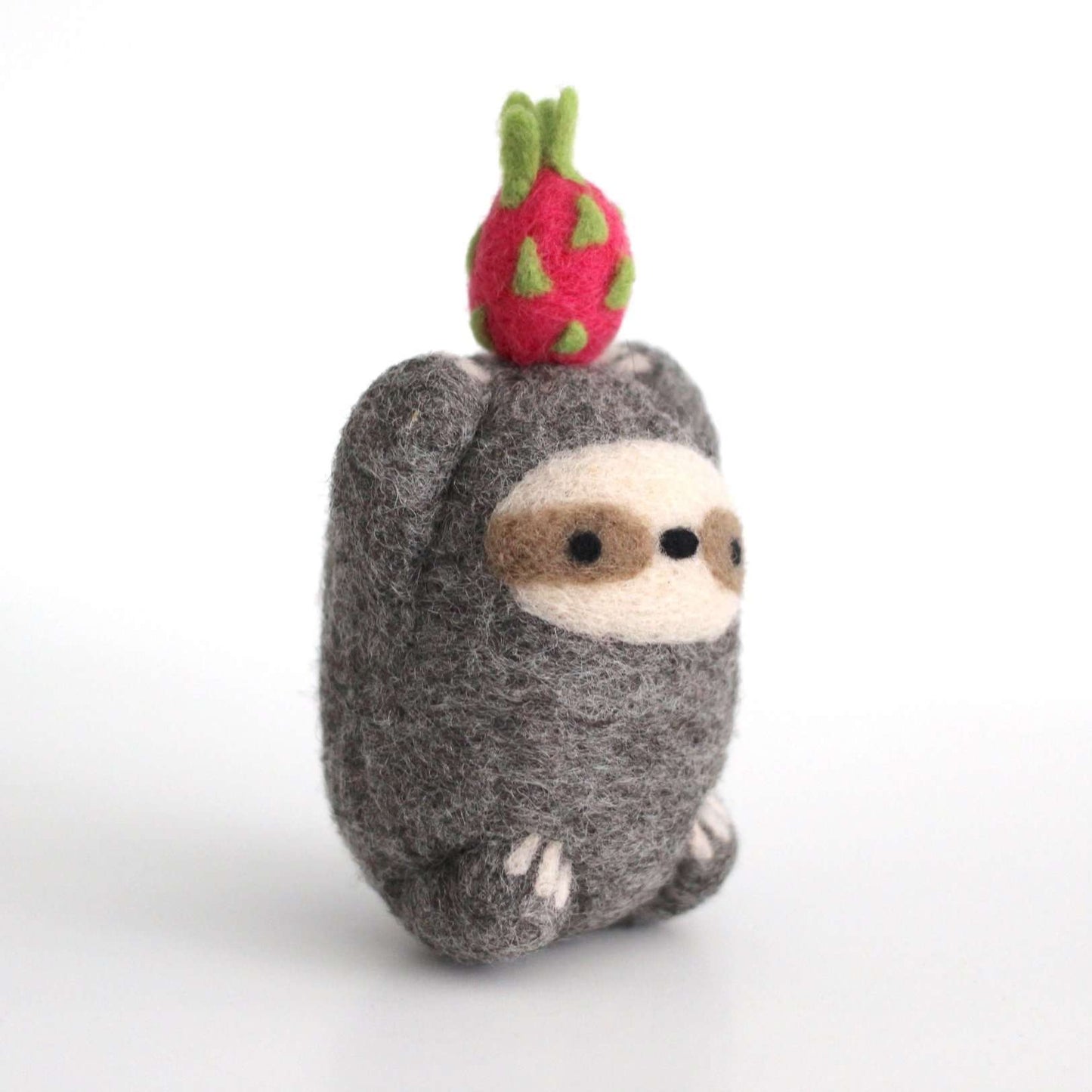 Needle Felted Sloth holding Dragon Fruit