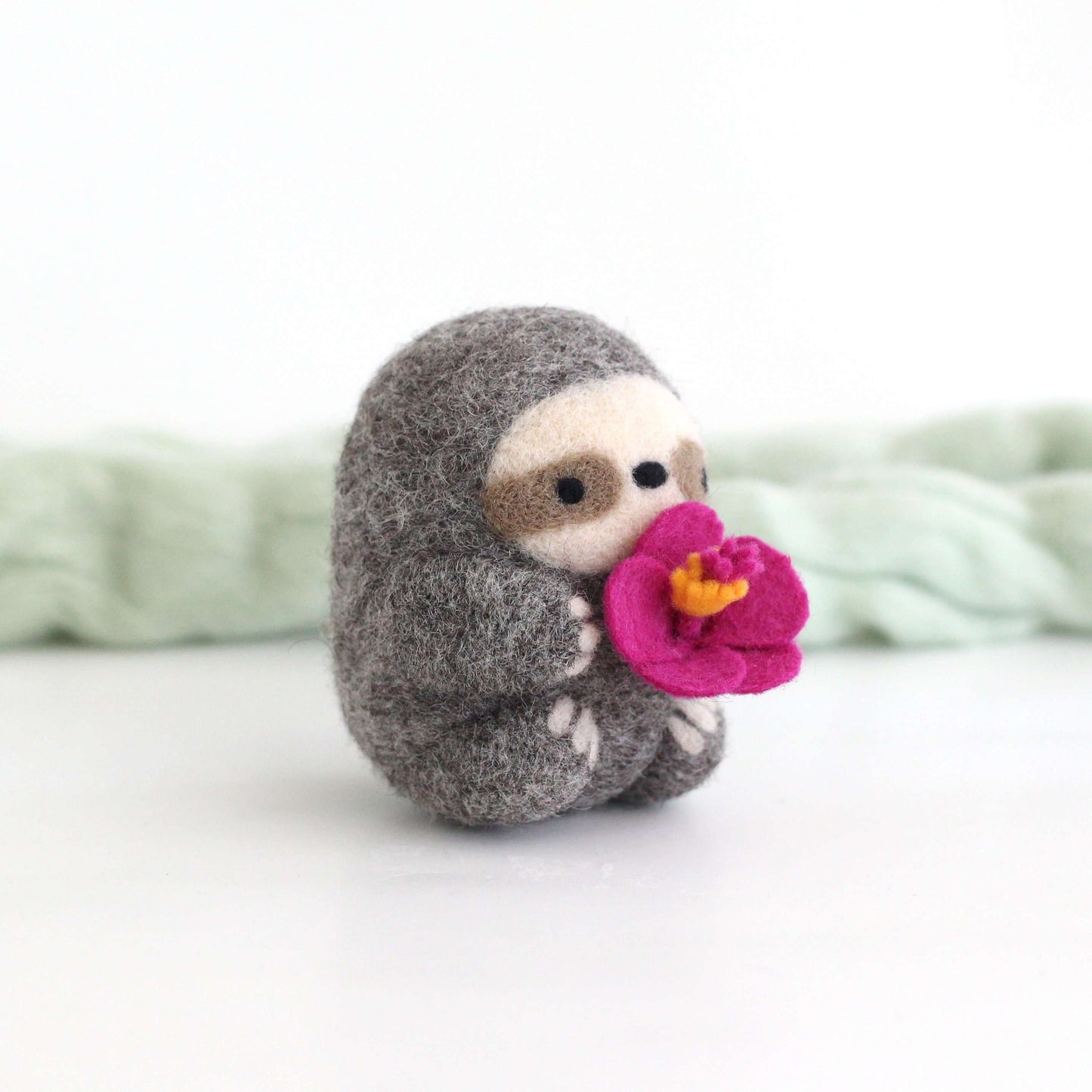 Needle Felted Sloth holding Hibiscus Flower